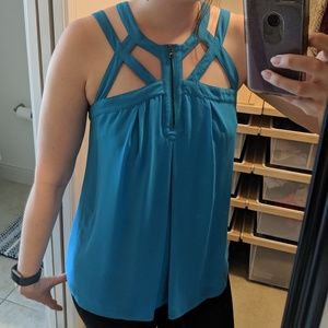 Flowy tank with cage strap detail